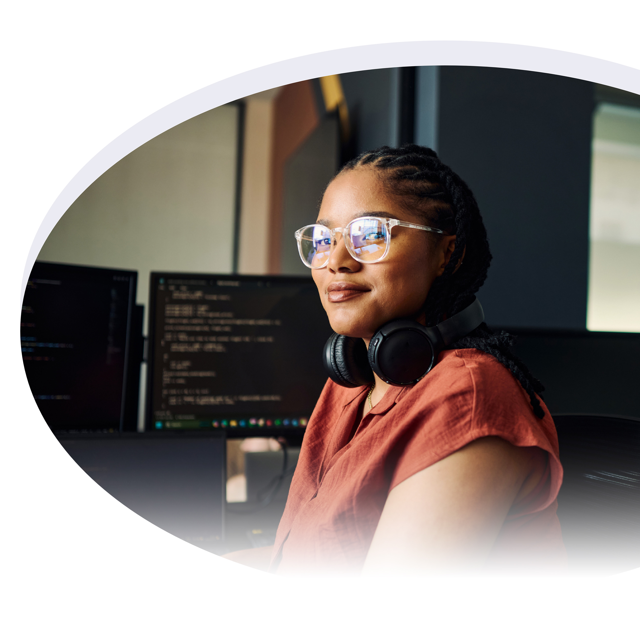 Young female software engineer smiles confidently